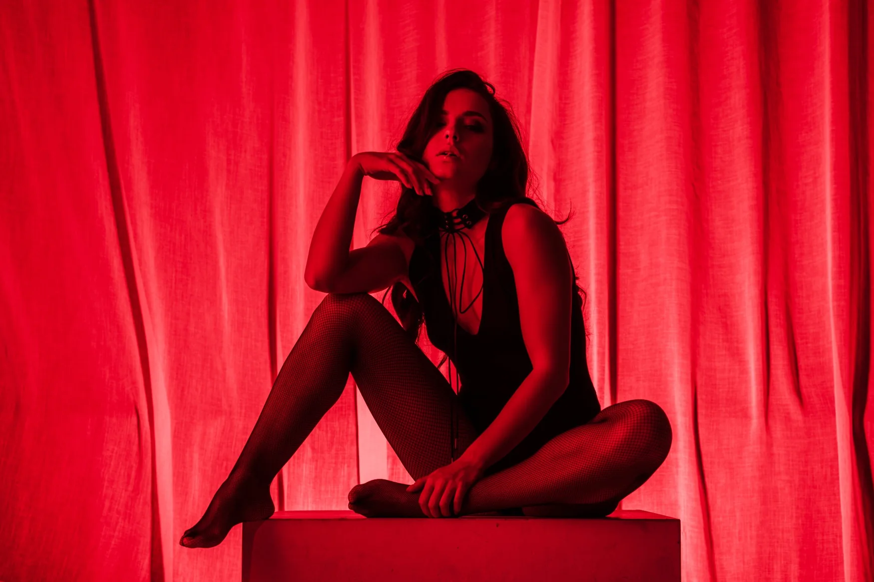 Dancer in dramatic red stage lighting